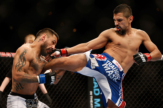 LAS VEGAS, NV - FEBRUARY 02: (R-L) Edwin Figueroa kicks Francisco Rivera during their bantamweight fight at UFC 156 on February 2, 2013 at the Mandalay Bay Events Center in Las Vegas, Nevada. (Photo by Josh Hedges/Zuffa LLC/Zuffa LLC via Getty Images) *** Local Caption *** Francisco Rivera; Edwin Figueroa