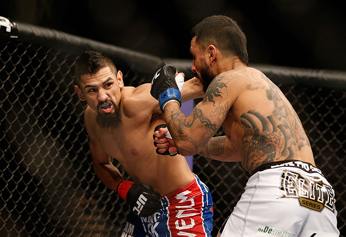 LAS VEGAS, NV - FEBRUARY 02: (L-R) Edwin Figueroa punches Francisco Rivera during their bantamweight fight at UFC 156 on February 2, 2013 at the Mandalay Bay Events Center in Las Vegas, Nevada. (Photo by Josh Hedges/Zuffa LLC/Zuffa LLC via Getty Images) *** Local Caption *** Francisco Rivera; Edwin Figueroa