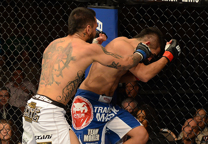 LAS VEGAS, NV - FEBRUARY 02: (L-R) Francisco Rivera punches Edwin Figueroa during their bantamweight fight at UFC 156 on February 2, 2013 at the Mandalay Bay Events Center in Las Vegas, Nevada. (Photo by Donald Miralle/Zuffa LLC/Zuffa LLC via Getty Images) *** Local Caption *** Francisco Rivera; Edwin Figueroa