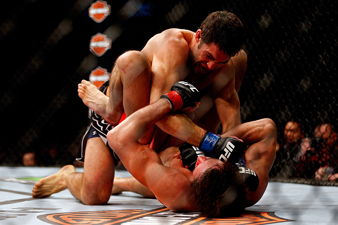 CHICAGO, IL - JANUARY 26: David Mitchell (Top) punches Simeon Thoresen (Bottom) during their Welterweight Bout part of Facebook Prelims at United Center on January 26, 2013 in Chicago, Illinois. (Photo by Josh Hedges/Zuffa LLC/Zuffa LLC Via Getty Images)
