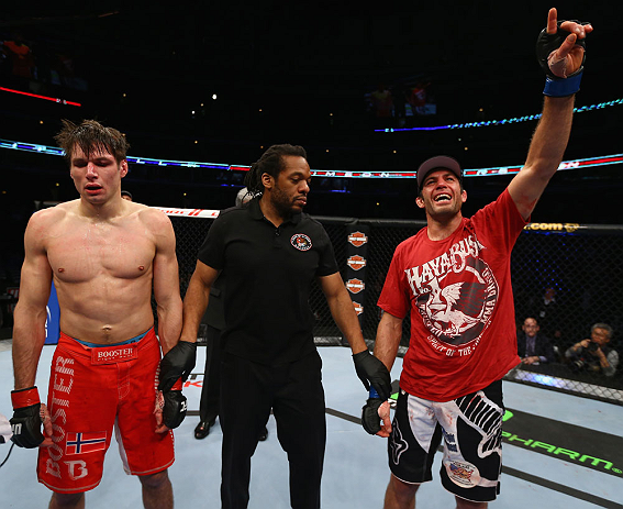 CHICAGO, IL - JANUARY 26:  David Mitchell (R) celebrates after defeating Simeon Thoresen (L) during their Welterweight Bout part of Facebook Prelims at United Center on January 26, 2013 in Chicago, Illinois.  (Photo by Al Bello/Zuffa LLC/Zuffa LLC Via Getty Images)