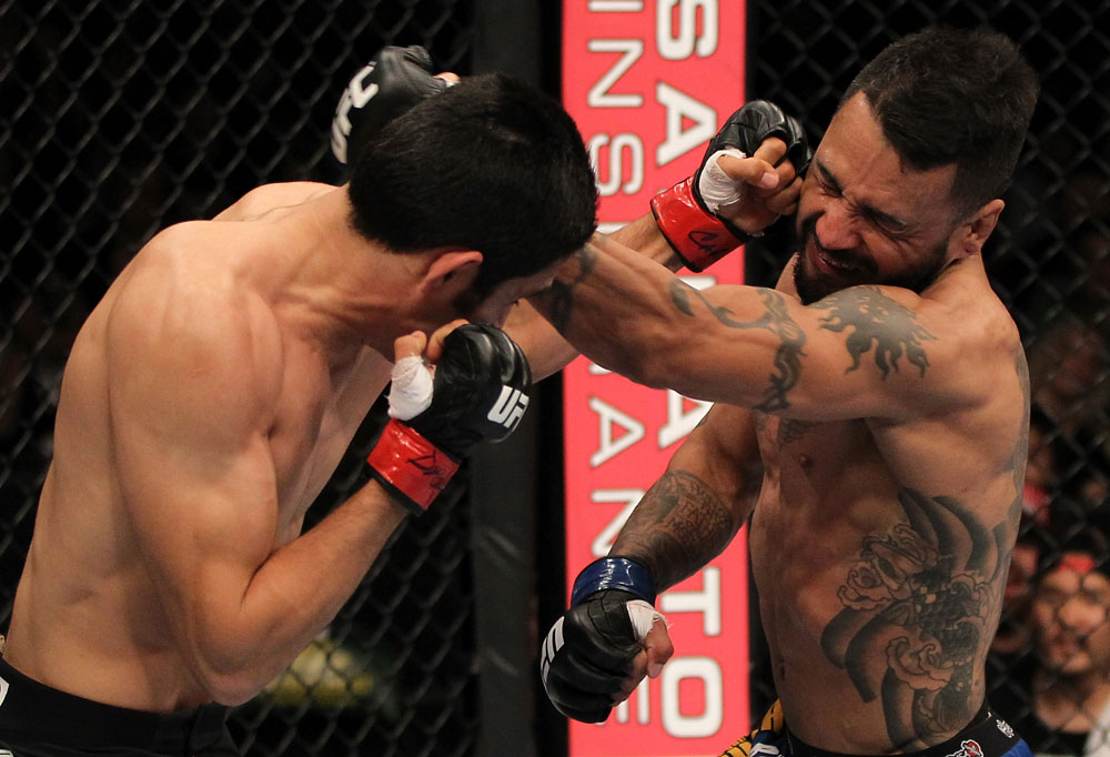 FAIRFAX, VA - MAY 15:  (L-R) Alex Soto and Francisco Rivera trade punches in a bantamweight bout during the UFC on Fuel TV event at Patriot Center on May 15, 2012 in Fairfax, Virginia.  (Photo by Josh Hedges/Zuffa LLC/Zuffa LLC via Getty Images)