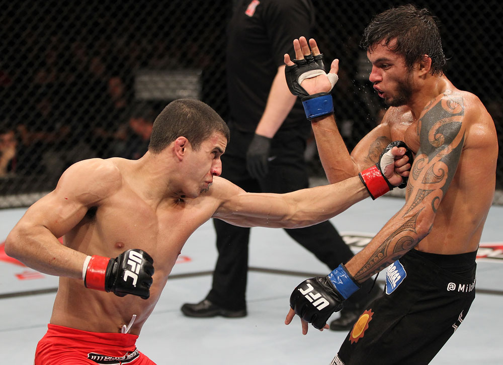 BELO HORIZONTE, BRAZIL - JUNE 23: (L-R) Felipe Arantes delivers a punch to the body of Milton Vieira during their UFC 147 featherweight bout at Estadio Jornalista Felipe Drummond on June 23, 2012 in Belo Horizonte, Brazil. (Photo by Josh Hedges/Zuffa LLC/Zuffa LLC via Getty Images)