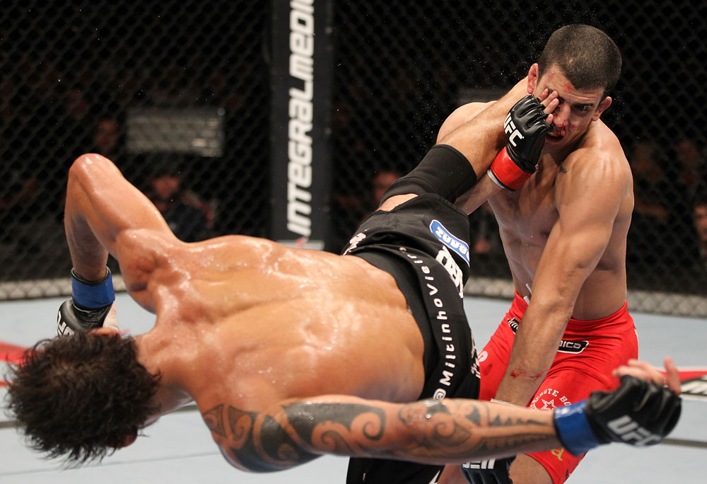 BELO HORIZONTE, BRAZIL - JUNE 23: (L-R) Milton Vieira delivers a spinning kick to the head of Felipe Arantes during their UFC 147 featherweight bout at Estadio Jornalista Felipe Drummond on June 23, 2012 in Belo Horizonte, Brazil. (Photo by Josh Hedges/Zuffa LLC/Zuffa LLC via Getty Images)