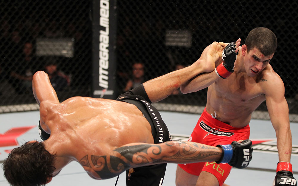 BELO HORIZONTE, BRAZIL - JUNE 23: (L-R) Milton Vieira delivers a spinning kick to the head of Felipe Arantes during their UFC 147 featherweight bout at Estadio Jornalista Felipe Drummond on June 23, 2012 in Belo Horizonte, Brazil. (Photo by Josh Hedges/Zuffa LLC/Zuffa LLC via Getty Images)