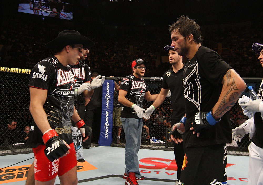 BELO HORIZONTE, BRAZIL - JUNE 23: Felipe Arantes (L) and Milton Vieira (R) react after their UFC 147 featherweight bout is declared a draw at Estadio Jornalista Felipe Drummond on June 23, 2012 in Belo Horizonte, Brazil. (Photo by Josh Hedges/Zuffa LLC/Zuffa LLC via Getty Images)