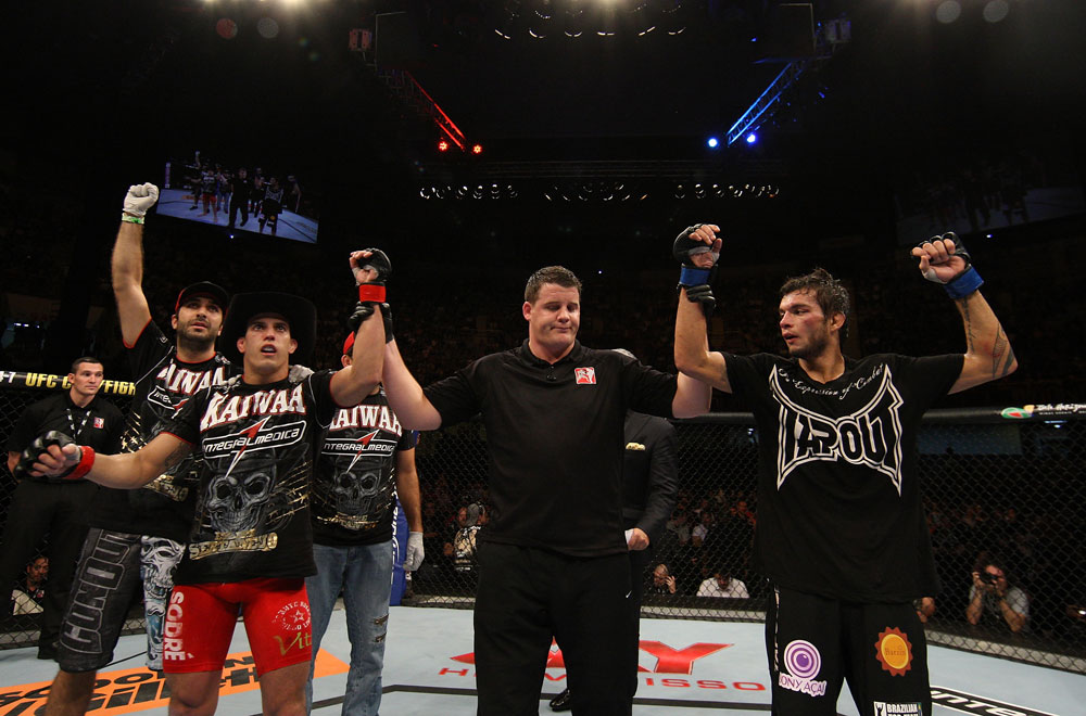 BELO HORIZONTE, BRAZIL - JUNE 23: Felipe Arantes (L) and Milton Vieira (R) react after their UFC 147 featherweight bout is declared a draw at Estadio Jornalista Felipe Drummond on June 23, 2012 in Belo Horizonte, Brazil. (Photo by Josh Hedges/Zuffa LLC/Zuffa LLC via Getty Images)