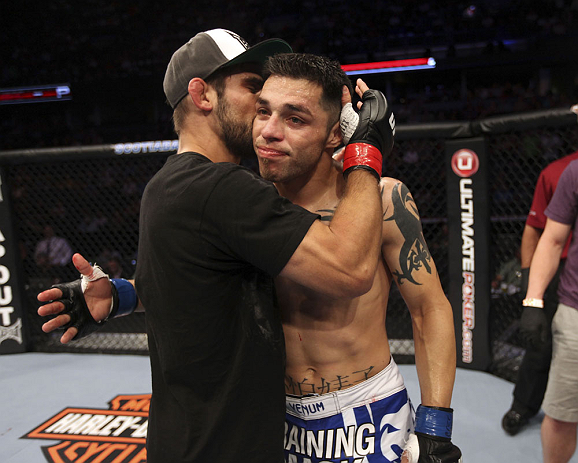 CALGARY, CANADA - JULY 21: (L-R) Antonio Carvalho hugs Daniel Pineda after Pineda was defeated by knockout in the first round during their featherweight bout at UFC 149 inside the Scotiabank Saddledome on July 21, 2012 in Calgary, Alberta, Canada.  (Photo by Nick Laham/Zuffa LLC/Zuffa LLC via Getty Images)