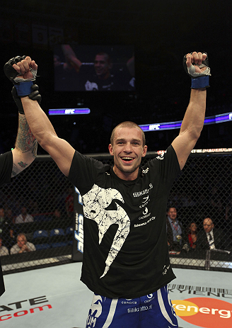 CALGARY, CANADA - JULY 21:  Anton Kuivanen celebrates after defeating Mitch Clarke after their lightweight bout at UFC 149 inside the Scotiabank Saddledome on July 21, 2012 in Calgary, Alberta, Canada.  (Photo by Nick Laham/Zuffa LLC/Zuffa LLC via Getty Images)