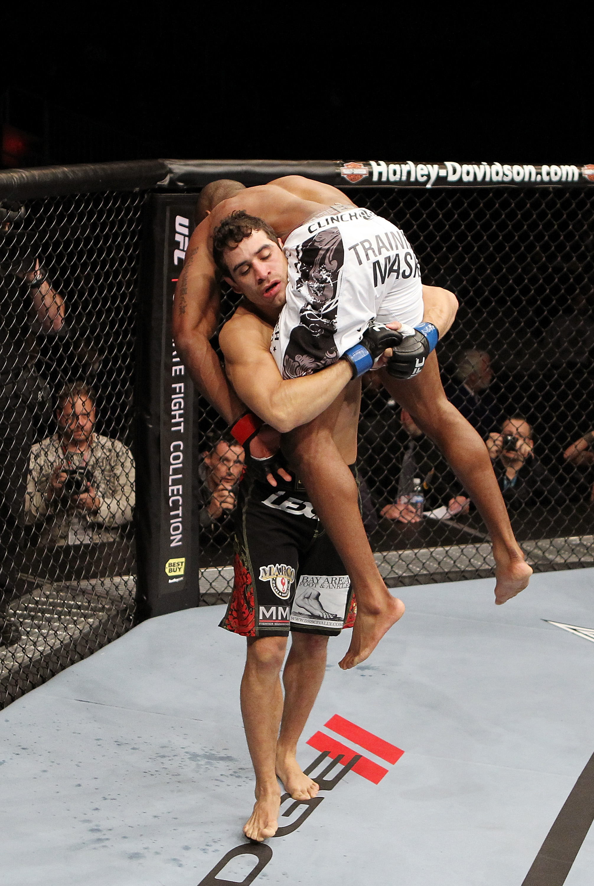 SAN JOSE, CA - NOVEMBER 19: (L-R) Danny Castillo picks up Shamar Bailey to slam him to the mat during a UFC Lightweight bout at the HP Pavillion on November 19, 2011 in San Jose, California. (Photo by Josh Hedges/Zuffa LLC/Zuffa LLC via Getty Images)
