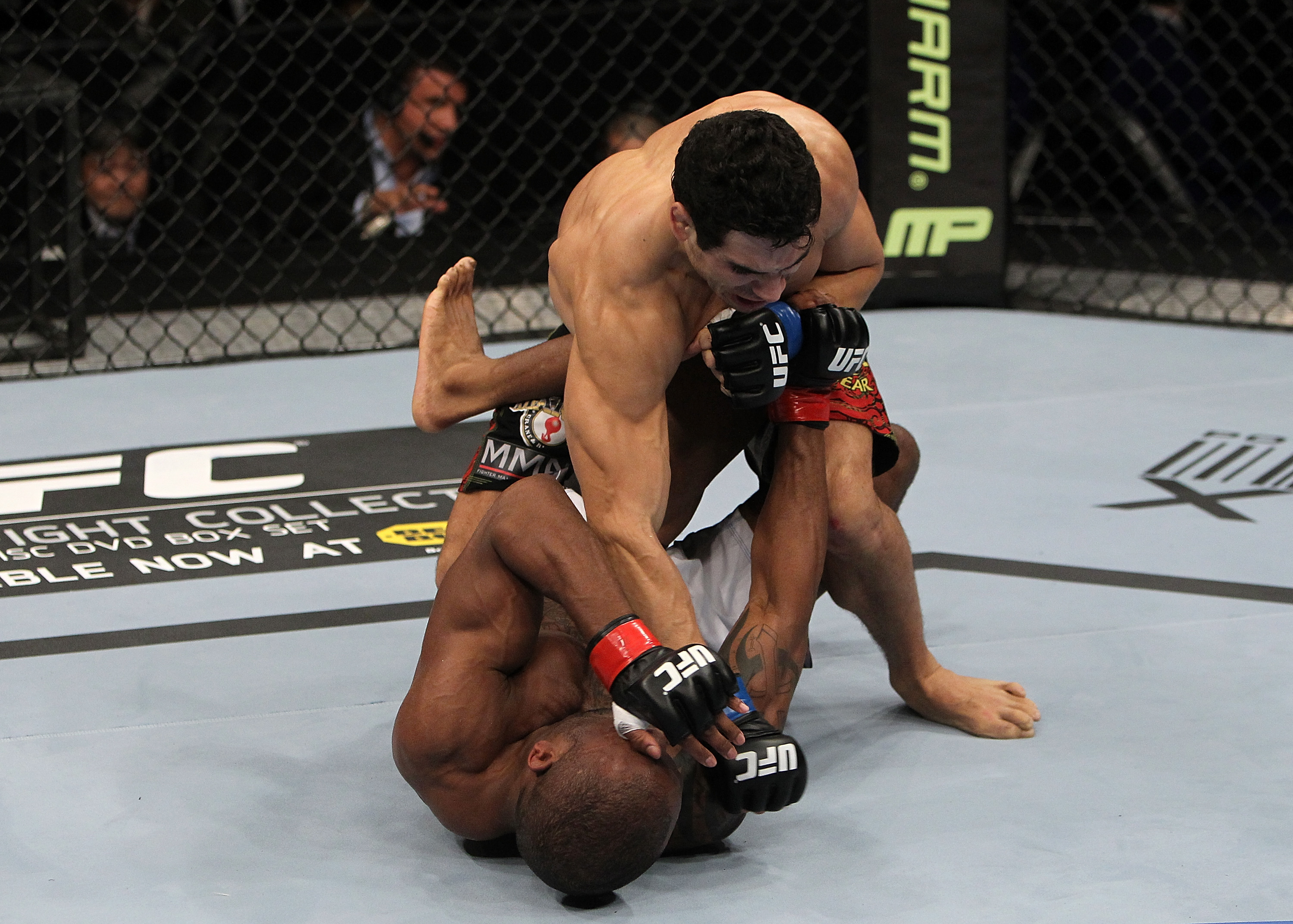 SAN JOSE, CA - NOVEMBER 19: Danny Castillo (top) punches Shamar Bailey (bottom) during an UFC Lightweight bout at the HP on November 19, 2011 in San Jose, California. (Photo by Josh Hedges/Zuffa LLC/Zuffa LLC via Getty Images)