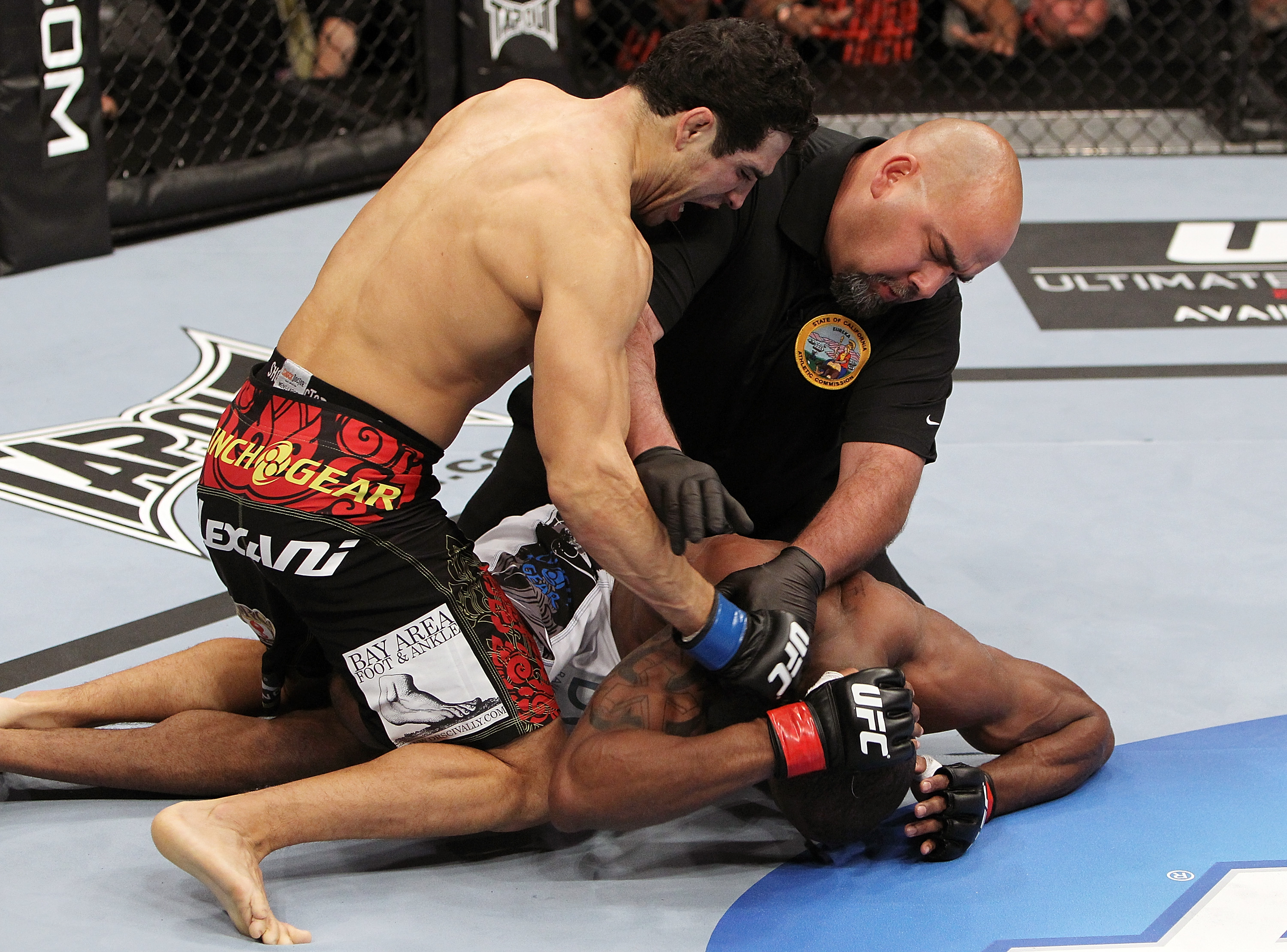 SAN JOSE, CA - NOVEMBER 19: Referee Jason McCoy stops the fight between Danny Castillo (top) and Shamar Bailey (bottom), declaring Castillo the winner during an UFC Lightweight bout at the HP Pavillion on November 19, 2011 in San Jose, California. (Photo by Josh Hedges/Zuffa LLC/Zuffa LLC via Getty Images)