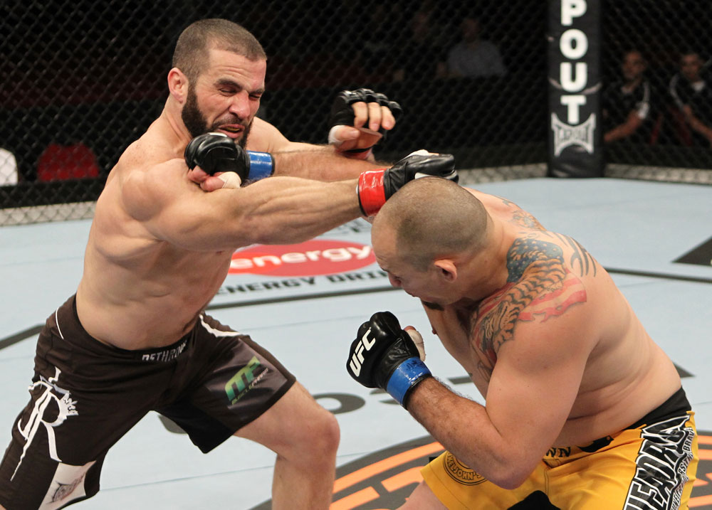 SYDNEY, AUSTRALIA - MARCH 03: (R-L) Shawn Jordan and Oli Thompson trade punches in a heavyweight bout during the UFC on FX event at Allphones Arena on March 3, 2012 in Sydney, Australia. (Photo by Josh Hedges/Zuffa LLC/Zuffa LLC via Getty Images) *** Local Caption *** Oli Thompson; Shawn Jordan
