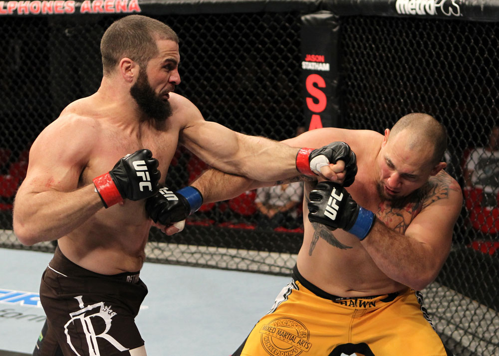 SYDNEY, AUSTRALIA - MARCH 03: (L-R) Oli Thompson punches Shawn Jordan in a heavyweight bout during the UFC on FX event at Allphones Arena on March 3, 2012 in Sydney, Australia. (Photo by Josh Hedges/Zuffa LLC/Zuffa LLC via Getty Images) *** Local Caption *** Oli Thompson; Shawn Jordan