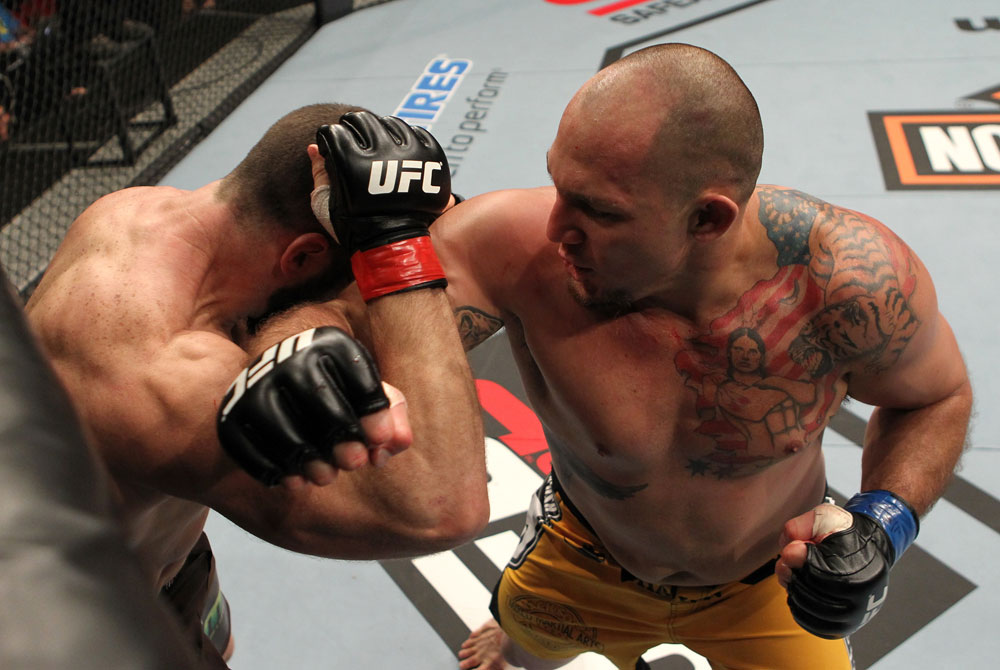 SYDNEY, AUSTRALIA - MARCH 03: (R-L) Shawn Jordan punches Oli Thompson in their heavyweight bout during the UFC on FX event at Allphones Arena on March 3, 2012 in Sydney, Australia. (Photo by Josh Hedges/Zuffa LLC/Zuffa LLC via Getty Images) *** Local Caption *** Oli Thompson; Shawn Jordan