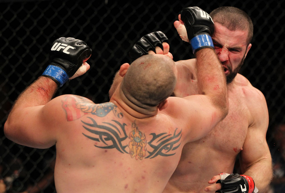 SYDNEY, AUSTRALIA - MARCH 03: (R-L) Oli Thompson punches Shawn Jordan in a heavyweight bout during the UFC on FX event at Allphones Arena on March 3, 2012 in Sydney, Australia. (Photo by Josh Hedges/Zuffa LLC/Zuffa LLC via Getty Images) *** Local Caption *** Oli Thompson; Shawn Jordan
