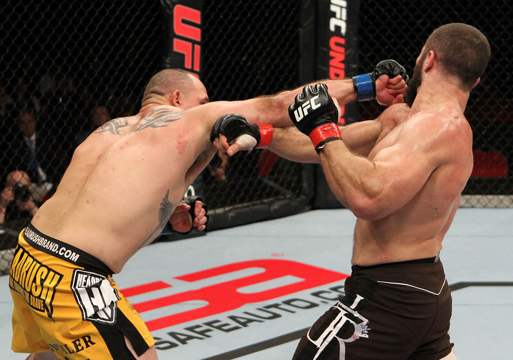 SYDNEY, AUSTRALIA - MARCH 03: (L-R) Shawn Jordan punches Oli Thompson in their heavyweight bout during the UFC on FX event at Allphones Arena on March 3, 2012 in Sydney, Australia. (Photo by Josh Hedges/Zuffa LLC/Zuffa LLC via Getty Images) *** Local Caption *** Oli Thompson; Shawn Jordan