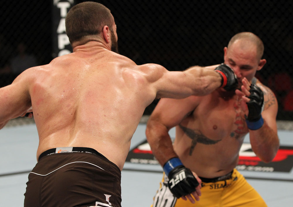 SYDNEY, AUSTRALIA - MARCH 03: (L-R) Oli Thompson punches Shawn Jordan in a heavyweight bout during the UFC on FX event at Allphones Arena on March 3, 2012 in Sydney, Australia. (Photo by Josh Hedges/Zuffa LLC/Zuffa LLC via Getty Images) *** Local Caption *** Oli Thompson; Shawn Jordan