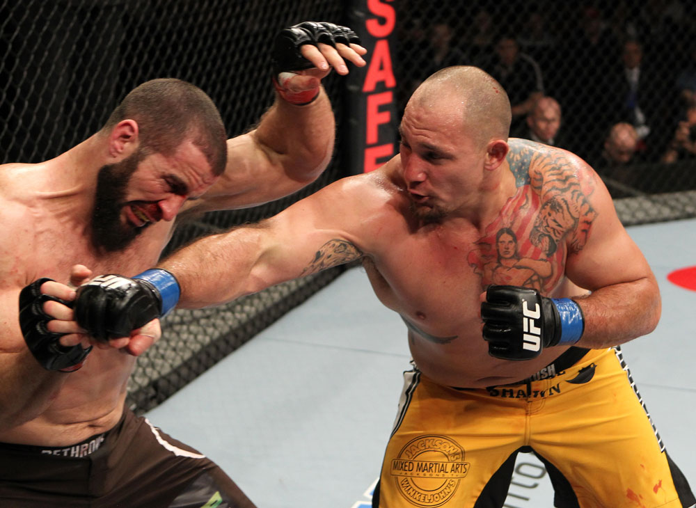 SYDNEY, AUSTRALIA - MARCH 03: (R-L) Shawn Jordan punches Oli Thompson in their heavyweight bout during the UFC on FX event at Allphones Arena on March 3, 2012 in Sydney, Australia. (Photo by Josh Hedges/Zuffa LLC/Zuffa LLC via Getty Images) *** Local Caption *** Oli Thompson; Shawn Jordan