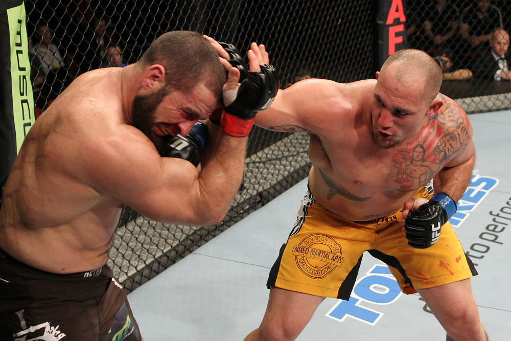 SYDNEY, AUSTRALIA - MARCH 03: (R-L) Shawn Jordan punches Oli Thompson in their heavyweight bout during the UFC on FX event at Allphones Arena on March 3, 2012 in Sydney, Australia. (Photo by Josh Hedges/Zuffa LLC/Zuffa LLC via Getty Images) *** Local Caption *** Oli Thompson; Shawn Jordan