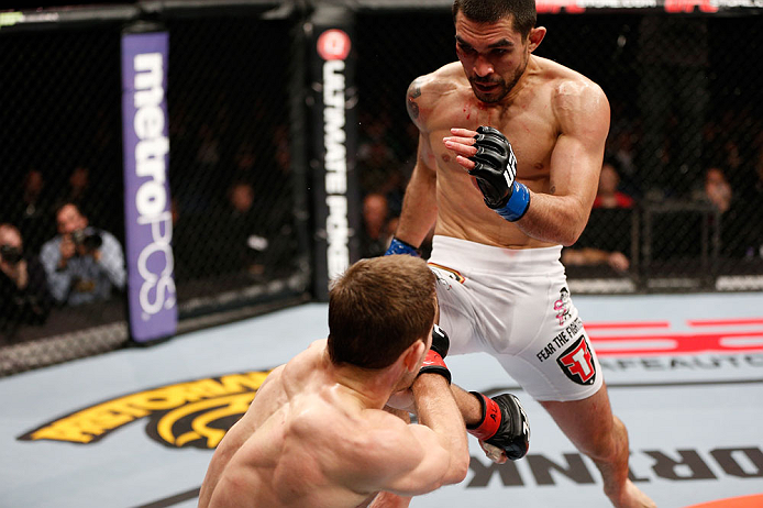 LONDON, ENGLAND - FEBRUARY 16: (R-L) Ulysses Gomez delivers a flying knee against Phil Harris in their flyweight fight during the UFC on Fuel TV event on February 16, 2013 at Wembley Arena in London, England. (Photo by Josh Hedges/Zuffa LLC/Zuffa LLC via Getty Images)