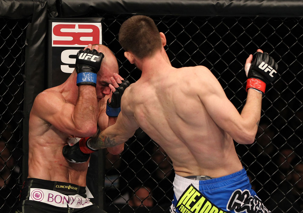 OMAHA, NE - FEBRUARY 15: (R-L) Tim Means punches Bernardo Magalhaes during the UFC on FUEL TV event at Omaha Civic Auditorium on February 15, 2012 in Omaha, Nebraska. (Photo by Josh Hedges/Zuffa LLC/Zuffa LLC via Getty Images) *** Local Caption *** Tim Means; Bernardo Magalhaes