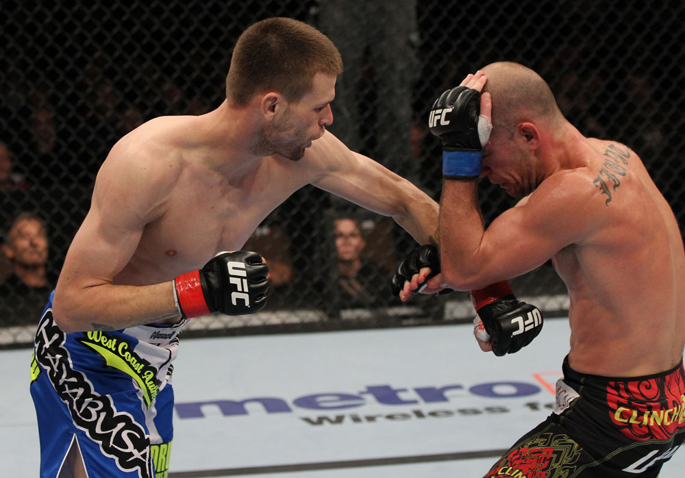 OMAHA, NE - FEBRUARY 15: (L-R) Tim Means punches Bernardo Magalhaes during the UFC on FUEL TV event at Omaha Civic Auditorium on February 15, 2012 in Omaha, Nebraska. (Photo by Josh Hedges/Zuffa LLC/Zuffa LLC via Getty Images) *** Local Caption *** Tim Means; Bernardo Magalhaes
