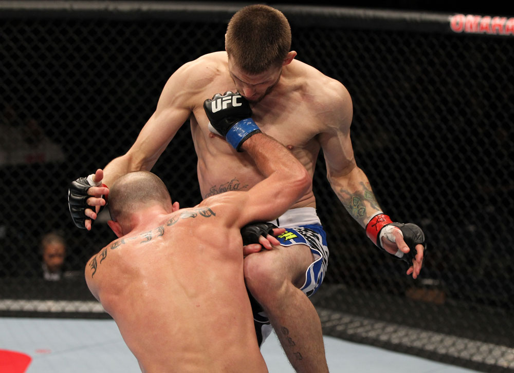 OMAHA, NE - FEBRUARY 15: (L-R) Bernardo Magalhaes and Tim Means trade strikes during the UFC on FUEL TV event at Omaha Civic Auditorium on February 15, 2012 in Omaha, Nebraska. (Photo by Josh Hedges/Zuffa LLC/Zuffa LLC via Getty Images) *** Local Caption *** Tim Means; Bernardo Magalhaes