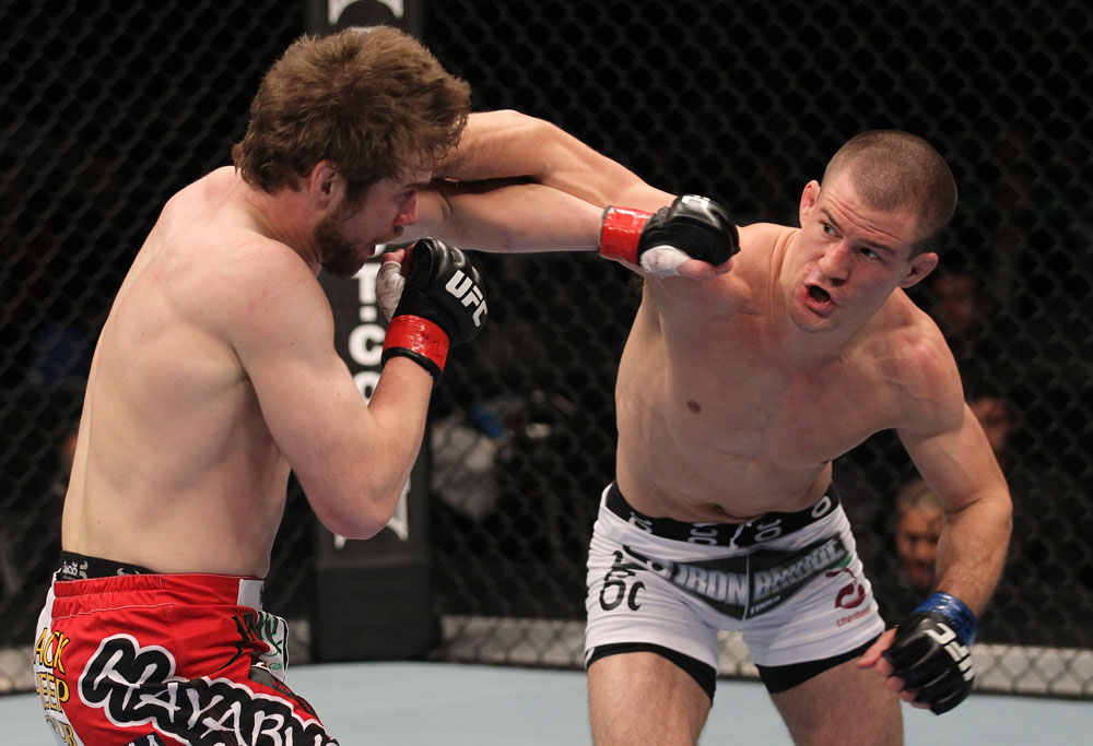 TORONTO, ON - DECEMBER 10:  (R-L) John Cholish punches Mitch Clarke during the UFC 140 event at Air Canada Centre on December 10, 2011 in Toronto, Canada.  (Photo by Nick Laham/Zuffa LLC/Zuffa LLC)