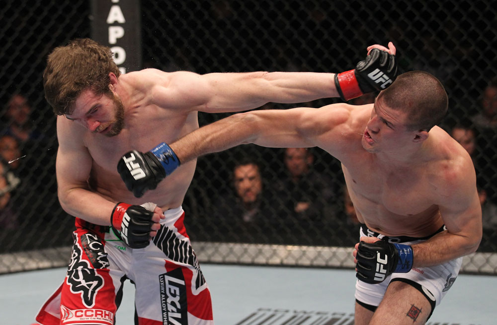 TORONTO, ON - DECEMBER 10:  (R-L) John Cholish punches Mitch Clarke during the UFC 140 event at Air Canada Centre on December 10, 2011 in Toronto, Canada.  (Photo by Nick Laham/Zuffa LLC/Zuffa LLC)