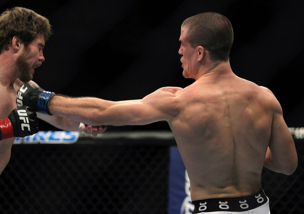 TORONTO, ON - DECEMBER 10:  (R-L) John Cholish punches Mitch Clarke during the UFC 140 event at Air Canada Centre on December 10, 2011 in Toronto, Ontario, Canada.  (Photo by Josh Hedges/Zuffa LLC/Zuffa LLC via Getty Images)