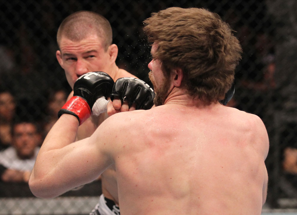 TORONTO, ON - DECEMBER 10:  (L-R) John Cholish punches Mitch Clarke during the UFC 140 event at Air Canada Centre on December 10, 2011 in Toronto, Canada.  (Photo by Nick Laham/Zuffa LLC/Zuffa LLC)