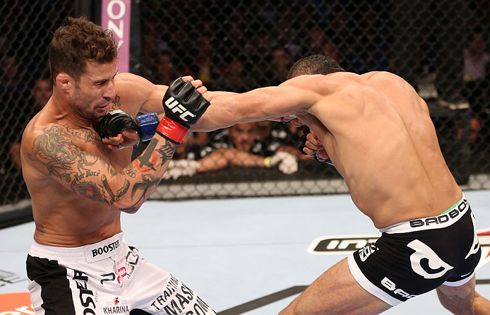 RIO DE JANEIRO, BRAZIL - OCTOBER 13:  (R-L) Reza Madadi punches Cristiano Marcello during their lightweight fight at UFC 153 inside HSBC Arena on October 13, 2012 in Rio de Janeiro, Brazil.  (Photo by Josh Hedges/Zuffa LLC/Zuffa LLC via Getty Images)