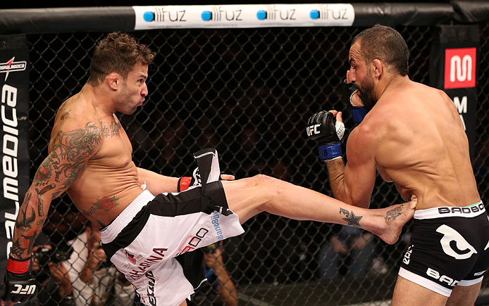 RIO DE JANEIRO, BRAZIL - OCTOBER 13:  (L-R) Cristiano Marcello kicks Reza Madadi during their lightweight fight at UFC 153 inside HSBC Arena on October 13, 2012 in Rio de Janeiro, Brazil.  (Photo by Josh Hedges/Zuffa LLC/Zuffa LLC via Getty Images)