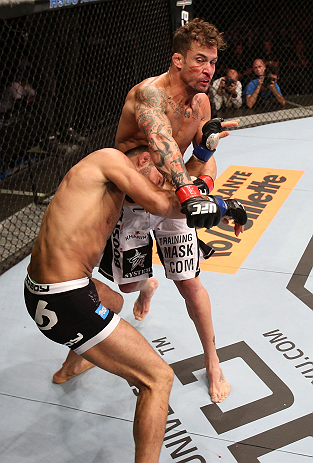 RIO DE JANEIRO, BRAZIL - OCTOBER 13:  (R-L) Cristiano Marcello punches Reza Madadi during their lightweight fight at UFC 153 inside HSBC Arena on October 13, 2012 in Rio de Janeiro, Brazil.  (Photo by Josh Hedges/Zuffa LLC/Zuffa LLC via Getty Images)