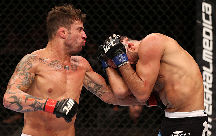 RIO DE JANEIRO, BRAZIL - OCTOBER 13:  (L-R) Cristiano Marcello punches Reza Madadi during their lightweight fight at UFC 153 inside HSBC Arena on October 13, 2012 in Rio de Janeiro, Brazil.  (Photo by Josh Hedges/Zuffa LLC/Zuffa LLC via Getty Images)
