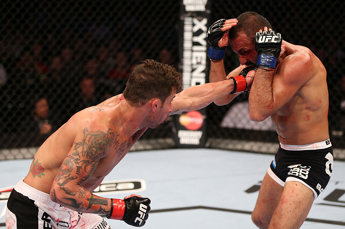 RIO DE JANEIRO, BRAZIL - OCTOBER 13:  (L-R) Cristiano Marcello punches Reza Madadi during their lightweight fight at UFC 153 inside HSBC Arena on October 13, 2012 in Rio de Janeiro, Brazil.  (Photo by Josh Hedges/Zuffa LLC/Zuffa LLC via Getty Images)