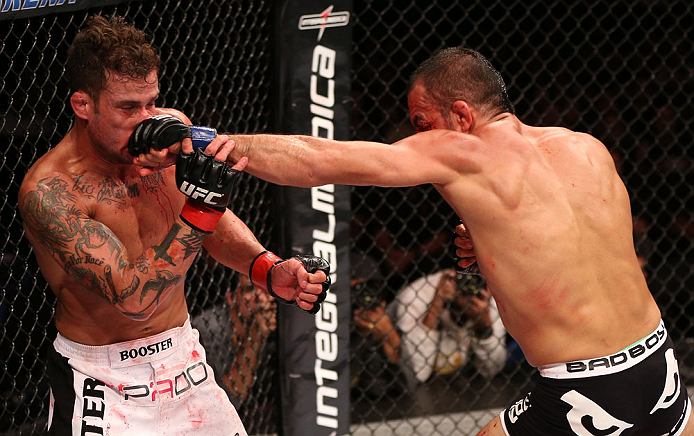 RIO DE JANEIRO, BRAZIL - OCTOBER 13:  (R-L) Reza Madadi punches Cristiano Marcello during their lightweight fight at UFC 153 inside HSBC Arena on October 13, 2012 in Rio de Janeiro, Brazil.  (Photo by Josh Hedges/Zuffa LLC/Zuffa LLC via Getty Images)