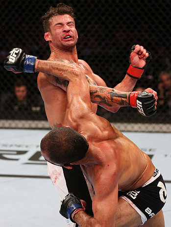 RIO DE JANEIRO, BRAZIL - OCTOBER 13:  (R-L) Reza Madadi punches Cristiano Marcello during their lightweight fight at UFC 153 inside HSBC Arena on October 13, 2012 in Rio de Janeiro, Brazil.  (Photo by Josh Hedges/Zuffa LLC/Zuffa LLC via Getty Images)