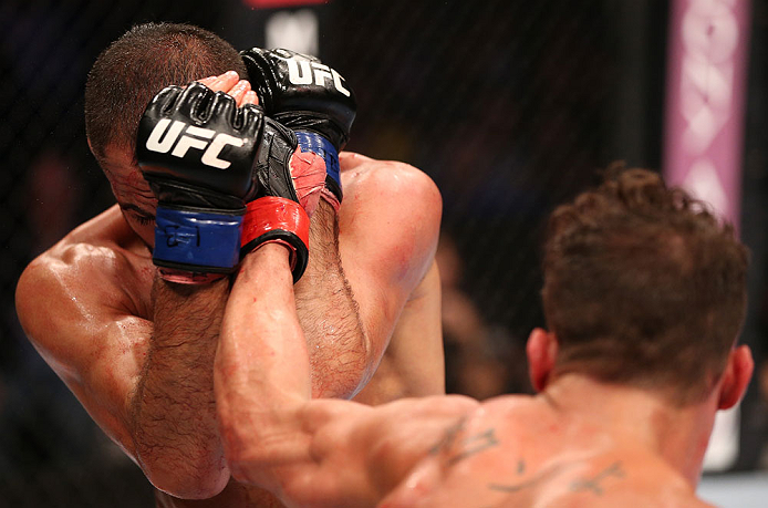 RIO DE JANEIRO, BRAZIL - OCTOBER 13:  (R-L) Cristiano Marcello punches Reza Madadi during their lightweight fight at UFC 153 inside HSBC Arena on October 13, 2012 in Rio de Janeiro, Brazil.  (Photo by Josh Hedges/Zuffa LLC/Zuffa LLC via Getty Images)