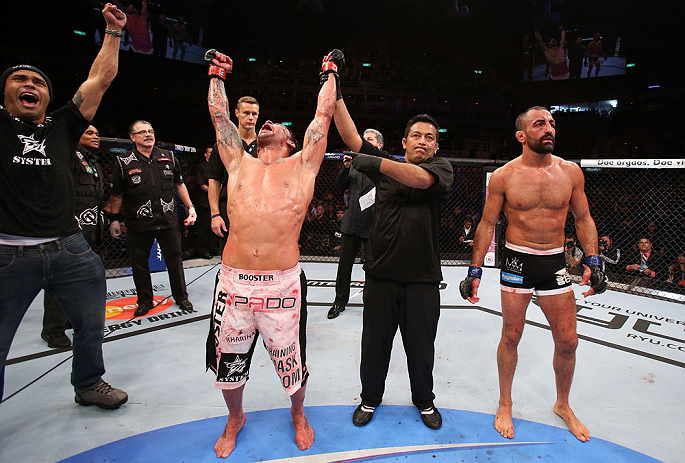 RIO DE JANEIRO, BRAZIL - OCTOBER 13:  Cristiano Marcello (L) reacts after defeating Reza Madadi during their lightweight fight at UFC 153 inside HSBC Arena on October 13, 2012 in Rio de Janeiro, Brazil.  (Photo by Josh Hedges/Zuffa LLC/Zuffa LLC via Getty Images)