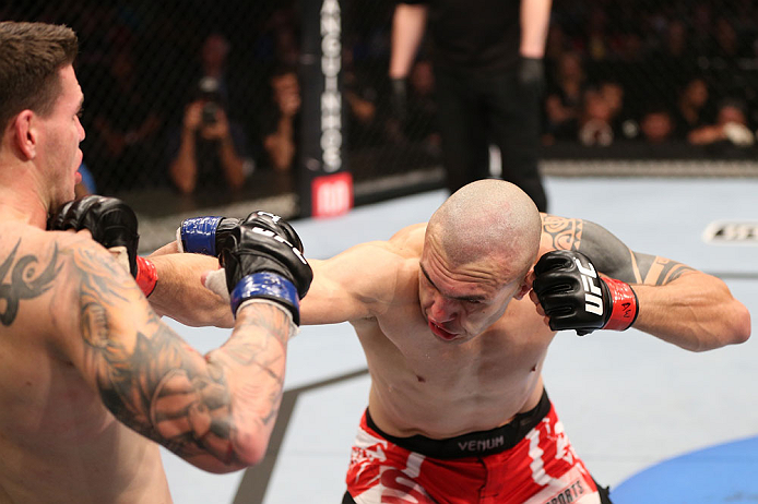 RIO DE JANEIRO, BRAZIL - OCTOBER 13:  (R-L) Luiz Cane punches Chris Camozzi during their middleweight fight at UFC 153 inside HSBC Arena on October 13, 2012 in Rio de Janeiro, Brazil.  (Photo by Josh Hedges/Zuffa LLC/Zuffa LLC via Getty Images)