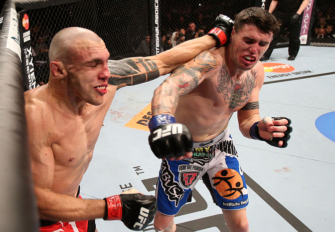 RIO DE JANEIRO, BRAZIL - OCTOBER 13:  (R-L) Chris Camozzi and Luiz Cane trade punches during their middleweight fight at UFC 153 inside HSBC Arena on October 13, 2012 in Rio de Janeiro, Brazil.  (Photo by Josh Hedges/Zuffa LLC/Zuffa LLC via Getty Images)
