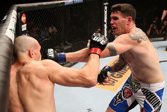 RIO DE JANEIRO, BRAZIL - OCTOBER 13:  (R-L) Chris Camozzi punches Luiz Cane during their middleweight fight at UFC 153 inside HSBC Arena on October 13, 2012 in Rio de Janeiro, Brazil.  (Photo by Josh Hedges/Zuffa LLC/Zuffa LLC via Getty Images)