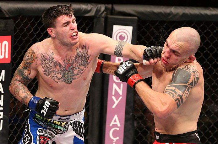 RIO DE JANEIRO, BRAZIL - OCTOBER 13:  (L-R) Chris Camozzi punches Luiz Cane during their middleweight fight at UFC 153 inside HSBC Arena on October 13, 2012 in Rio de Janeiro, Brazil.  (Photo by Josh Hedges/Zuffa LLC/Zuffa LLC via Getty Images)