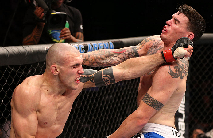 RIO DE JANEIRO, BRAZIL - OCTOBER 13:  (L-R) Luiz Cane punches Chris Camozzi during their middleweight fight at UFC 153 inside HSBC Arena on October 13, 2012 in Rio de Janeiro, Brazil.  (Photo by Josh Hedges/Zuffa LLC/Zuffa LLC via Getty Images)