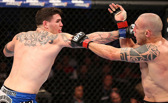 RIO DE JANEIRO, BRAZIL - OCTOBER 13:  (L-R) Chris Camozzi punches Luiz Cane during their middleweight fight at UFC 153 inside HSBC Arena on October 13, 2012 in Rio de Janeiro, Brazil.  (Photo by Josh Hedges/Zuffa LLC/Zuffa LLC via Getty Images)