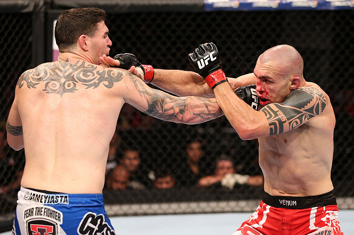 RIO DE JANEIRO, BRAZIL - OCTOBER 13:  (L-R) Chris Camozzi punches Luiz Cane during their middleweight fight at UFC 153 inside HSBC Arena on October 13, 2012 in Rio de Janeiro, Brazil.  (Photo by Josh Hedges/Zuffa LLC/Zuffa LLC via Getty Images)