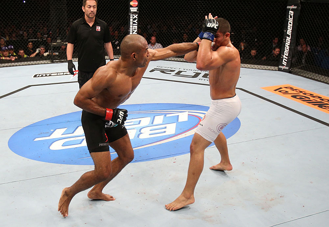 RIO DE JANEIRO, BRAZIL - OCTOBER 13:  (L-R) Sergio Moraes punches Renee Forte during their welterweight fight at UFC 153 inside HSBC Arena on October 13, 2012 in Rio de Janeiro, Brazil.  (Photo by Josh Hedges/Zuffa LLC/Zuffa LLC via Getty Images)