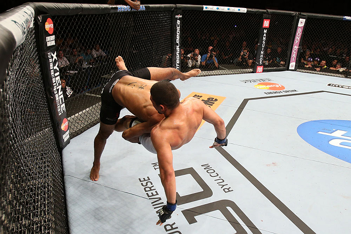 RIO DE JANEIRO, BRAZIL - OCTOBER 13:  (L-R) Sergio Moraes takes down Renee Forte during their welterweight fight at UFC 153 inside HSBC Arena on October 13, 2012 in Rio de Janeiro, Brazil.  (Photo by Josh Hedges/Zuffa LLC/Zuffa LLC via Getty Images)